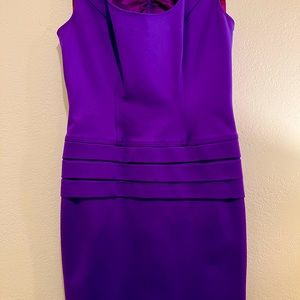 Fitted slendering purple mini dress.